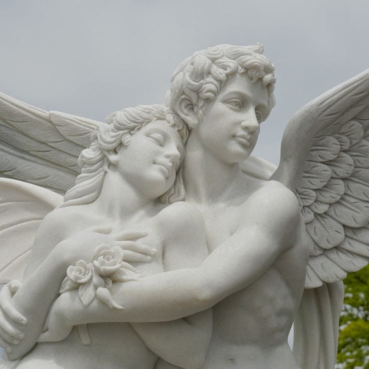 A marble statue of two winged figures embracing captures the essence of relationships; one holds roses, eyes closed, resting on the other's shoulder, evoking an intimate exploration of sexuality.